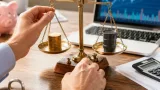 Gold edges up as oil eases and markets brace for Fed decision